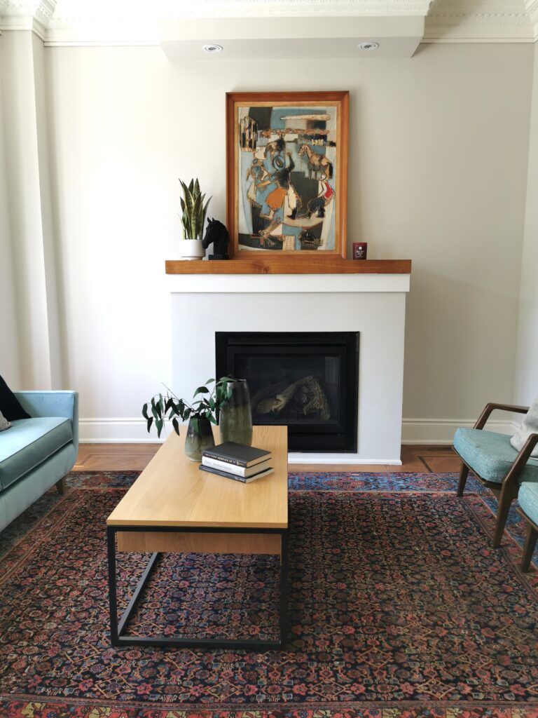 accentric Living room with fireplace and mid century modern chairs