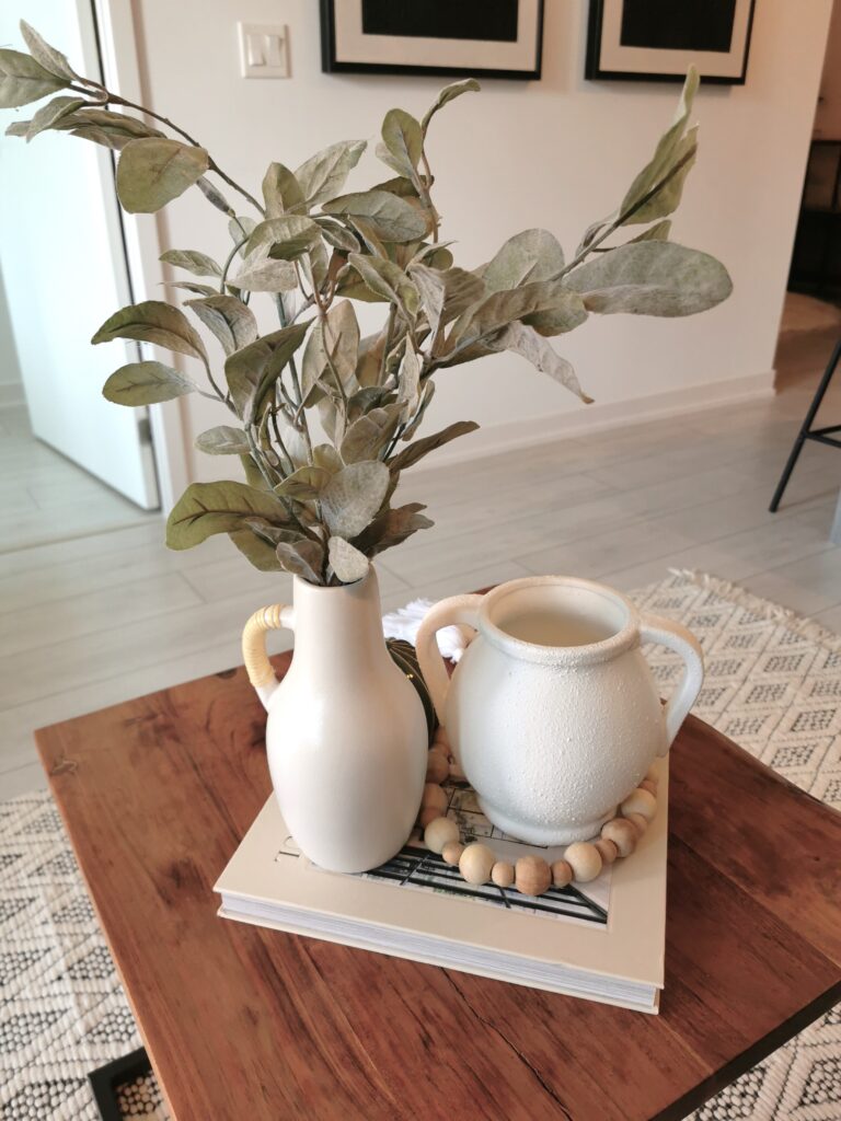 coffee table decors with vase and statement books