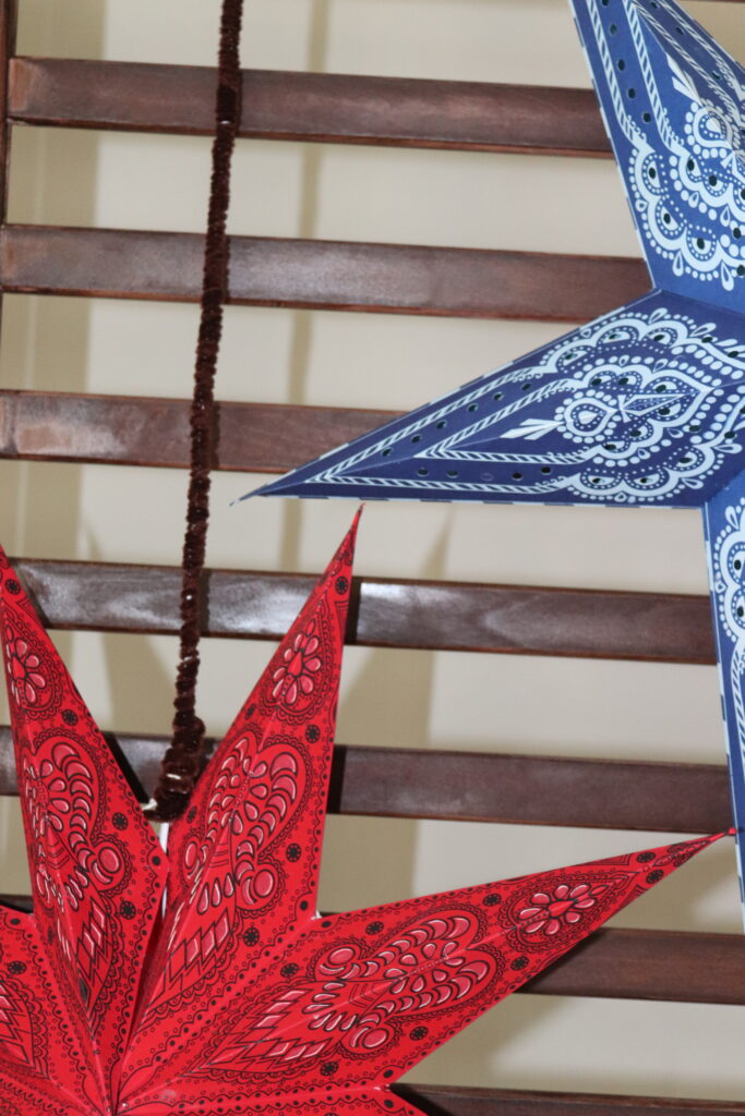 Red and blue chinese lanterns hanging from the wall