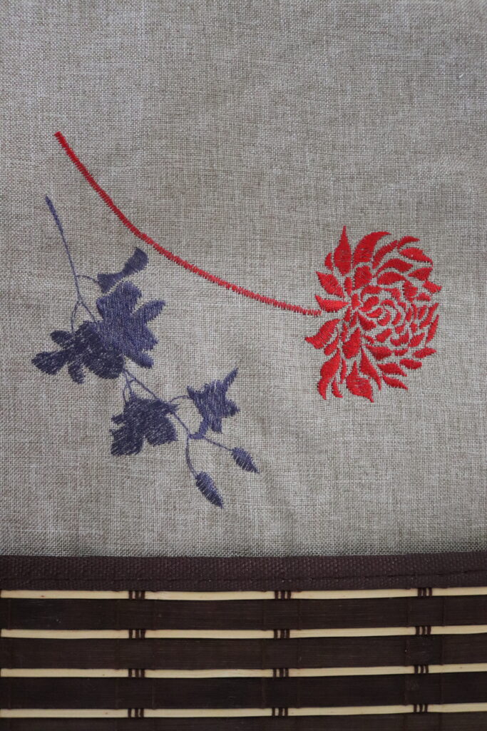 red rose embroidery on table cloth