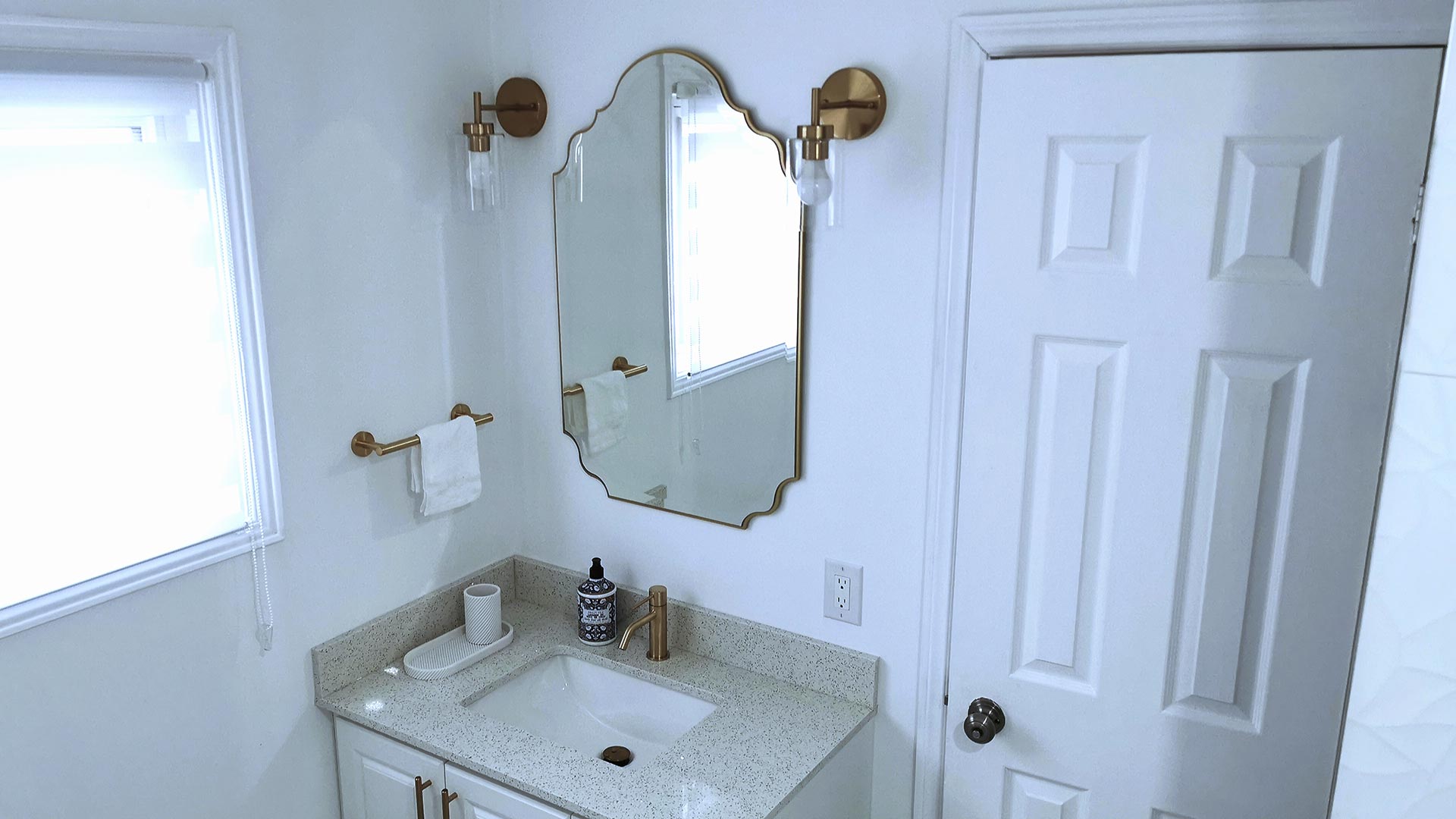 Master Bathroom renovation showing sink with feature mirror