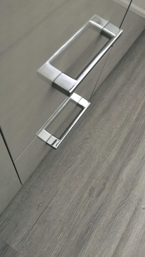 Close up of bathroom cabinet hardware